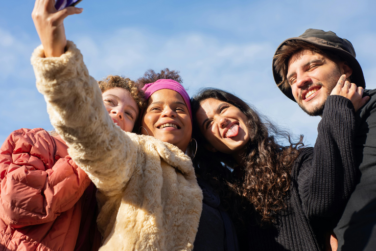 A group of teenagers pose for a photo